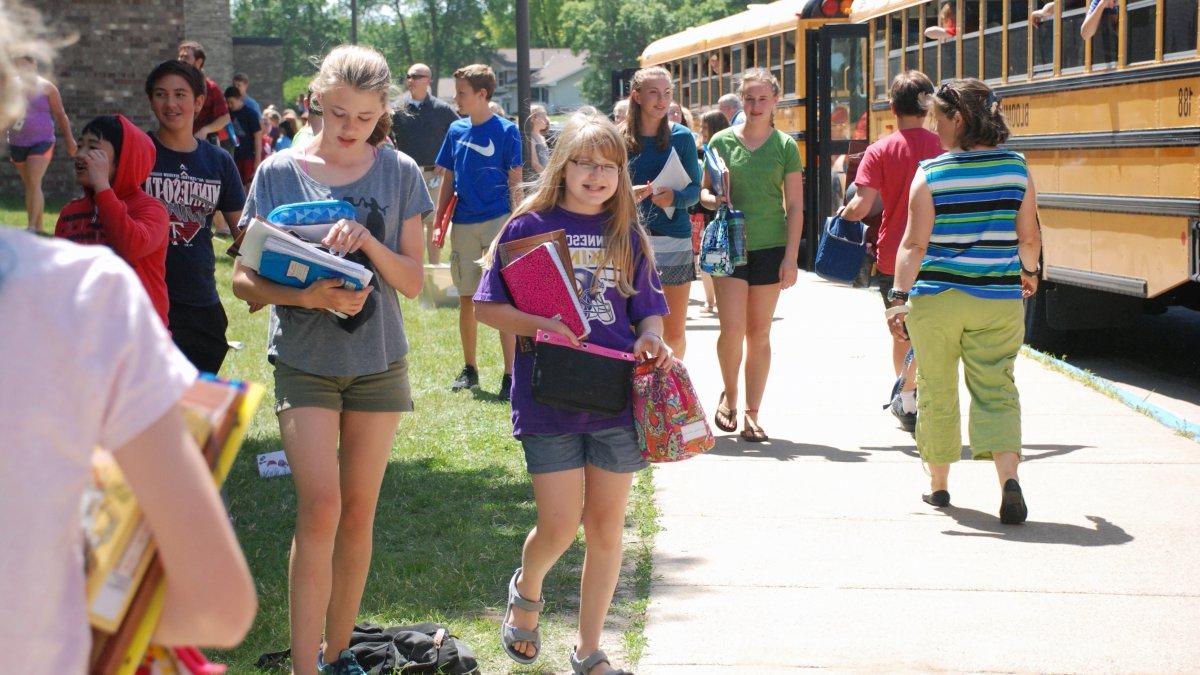 Students head to the buses after school