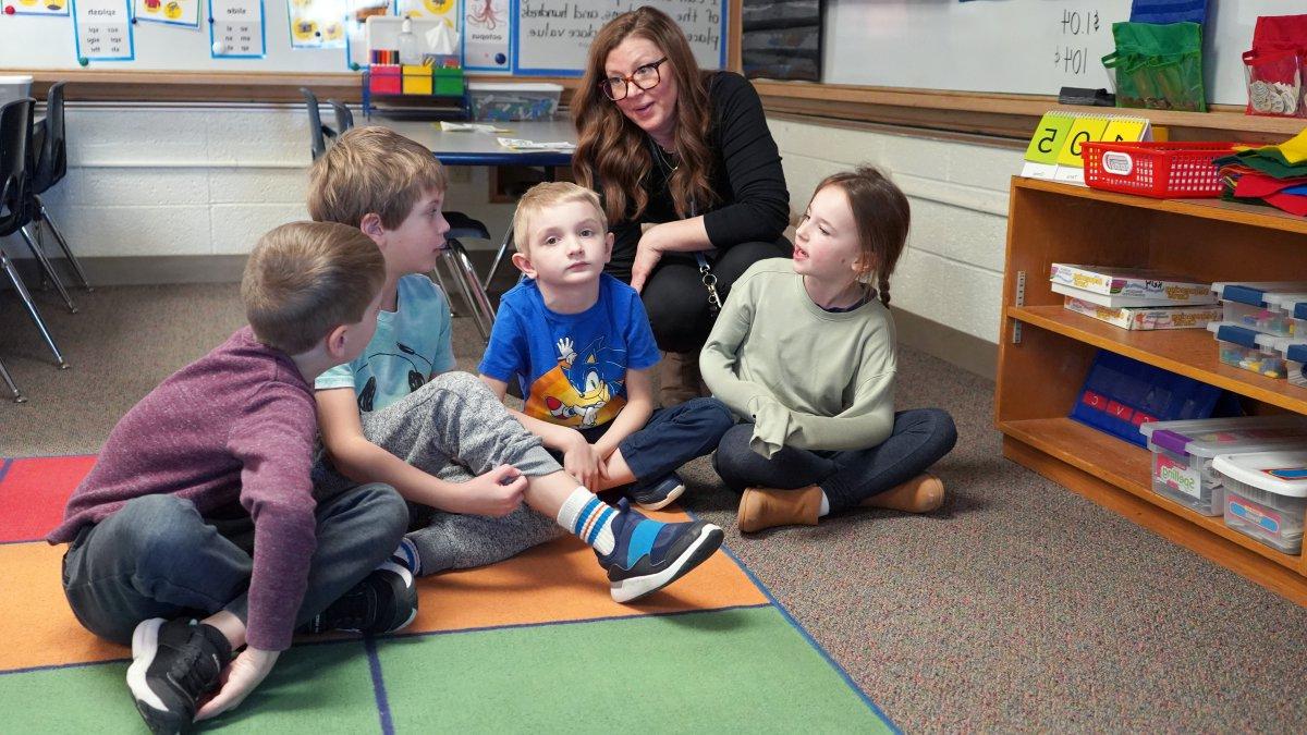 teacher talking to students